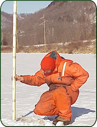 USGS's Pete Boma measuring depth. (photo)