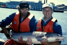 USGS scientists Bob Kennedy and Brent Knights holding a lake sturgeon